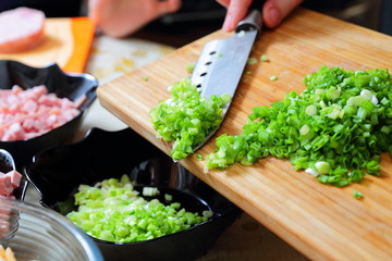 Preparing russian traditional salad Olivier