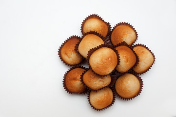 Cupcakes in decorative arrangement on white background