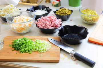 Preparing russian traditional salad Olivier