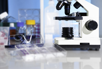 Microscope and plastic safety glasses