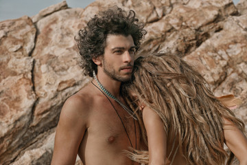 Young pair on the stone beach in Phangan