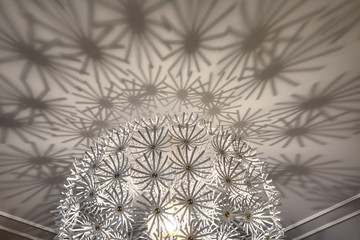 Closeup design ceiling chandelier in a modern interior
