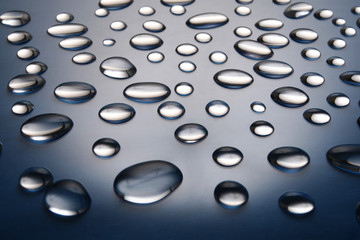 drops of water on a dark blue gradient background
