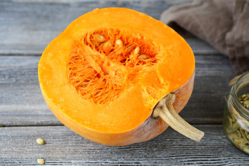 Fresh half pumpkin on the boards