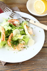 Delicious salad with shrimps, lettuce and cheese