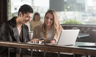 Friends at the cafe using a smart phone