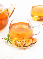 Glass Cup Tea with biscuits,cinnamon