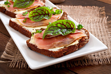 Small snacks sandwiches with salty salmon