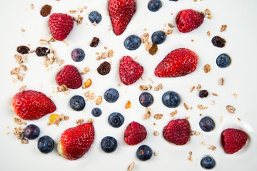 fresh berries fruits isolated on greek yogurt, healthy backgroun