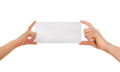 Adult's hand and child's hand holding white paper, cardboard. 