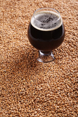 Snifter with stout over malt