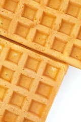 Close - up Delicious sweet waffle on white background .