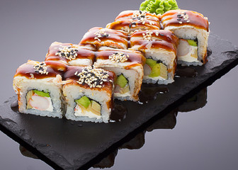 Japanese sushi with eel on a stone plate