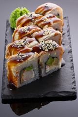 Japanese sushi with eel on a stone plate