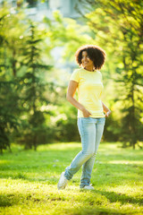 Young woman walking in park