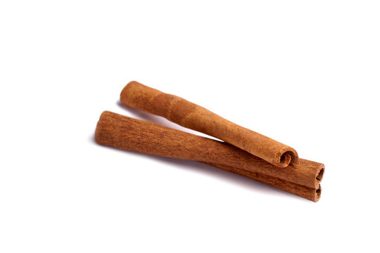 Two cinnamon sticks isolated on white