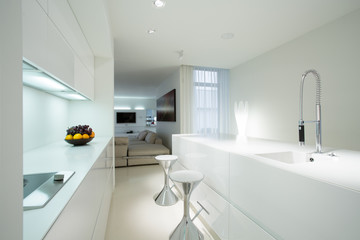 Fototapeta na wymiar White kitchen in contemporary house