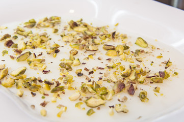 Closeup of natural yoghurt with pistachio