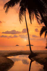 Sunset over the beautiful tropical beach