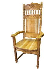 Fototapeta premium Vintage carved wooden chair isolated over white