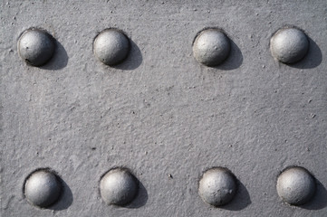 Fototapeta na wymiar detail of eigth rivets at an old bridge