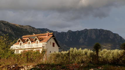 Fototapeta na wymiar The old house with view on the mountains
