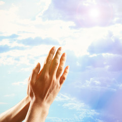 Human hands on sky background © Africa Studio