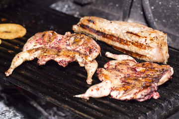 grilling quail in the kitchen at the restaurant