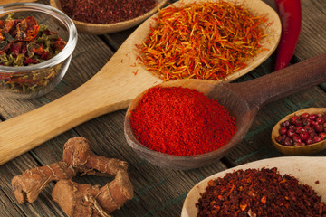 Spice. Various Spices over Wooden Background