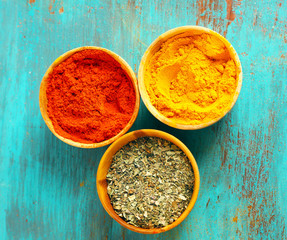 Different seasoning in wooden bowls