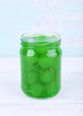 Homemade jar of green maraschino cherry