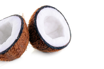 Coconut cut in half isolated on white background