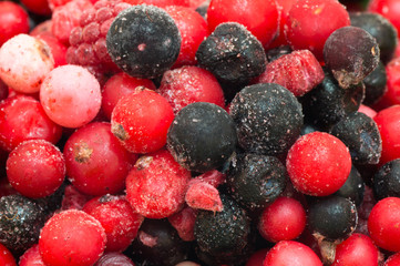Different type of frozen berries, on and next to each other