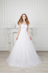 Slim beautiful woman with long hair wearing luxurious wedding