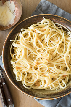 Spaghetti with Olive Oil and Garlic Served with Cheese Shavings