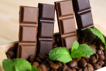 Still life with set of chocolate in wooden box of coffee