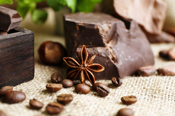 Still life with set of spicy chocolate, nuts and coffee beans