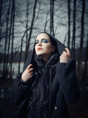 Fashionable woman, outdoor posing in March