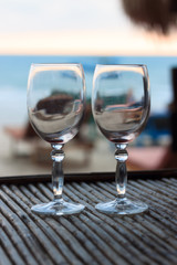 Beach evening on the sunset with two glasses