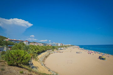 Fototapeta na wymiar The beach on a Sunny day at the seaside in Spain
