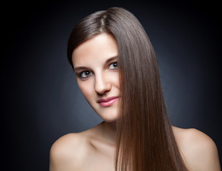 Naklejka premium Beautiful brunette with long straight hair