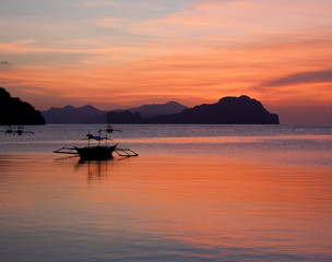Naklejka na ściany i meble Sunset on a tropical island. El Nido. Philippines.
