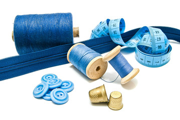 blue zipper, buttons and spools of thread