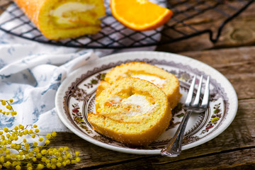 swiss roll with whipped cream and orange cream