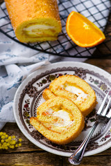 swiss roll with whipped cream and orange cream