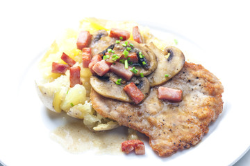 fried pork fillet with ham, mushrooms and potatoes