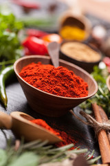 Various spices on black stone