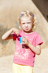 little girl eating yogurt