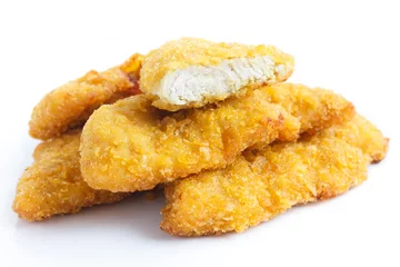  Golden fried chicken strips on white. © Moving Moment