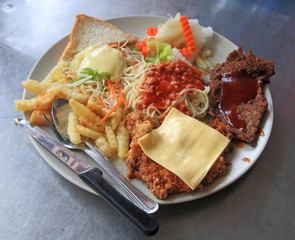 meat steak with red sauce spaghetti and salad